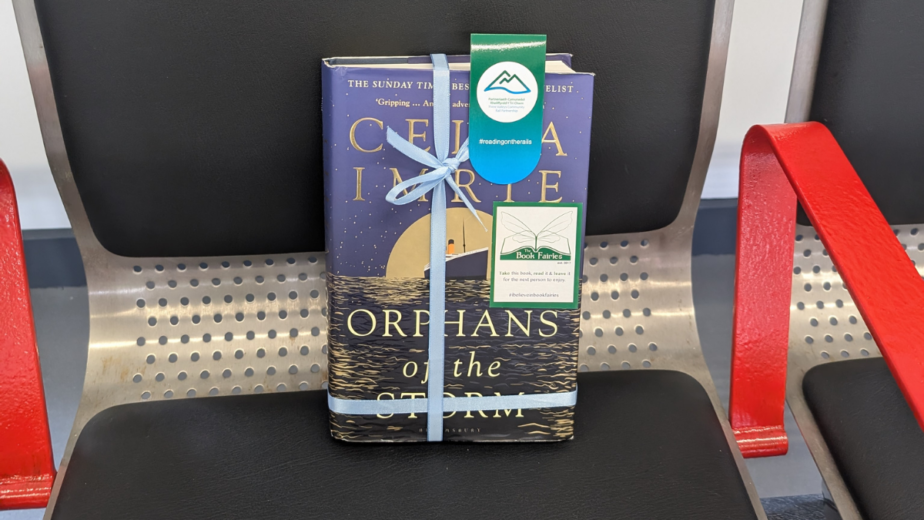 A book wrapped in ribbon on a seat